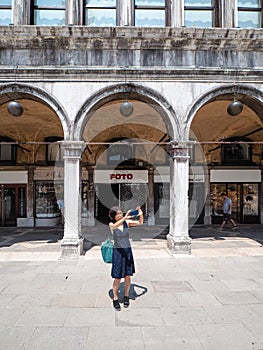 Venice, San Marco, Italy - July 2020. Tourist are slowly back in deserted Venice  Saint Marcus square after covid-19 outbreak city